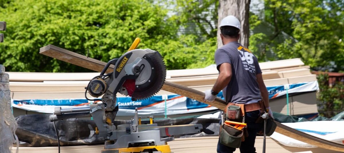 Technician working with wood and saw equipment