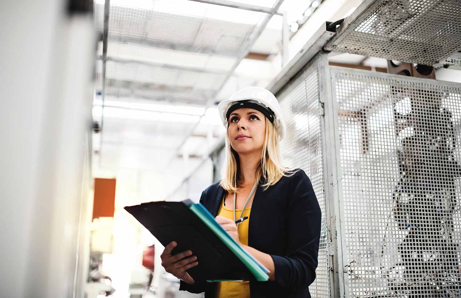 woman worker writing on a clipboard