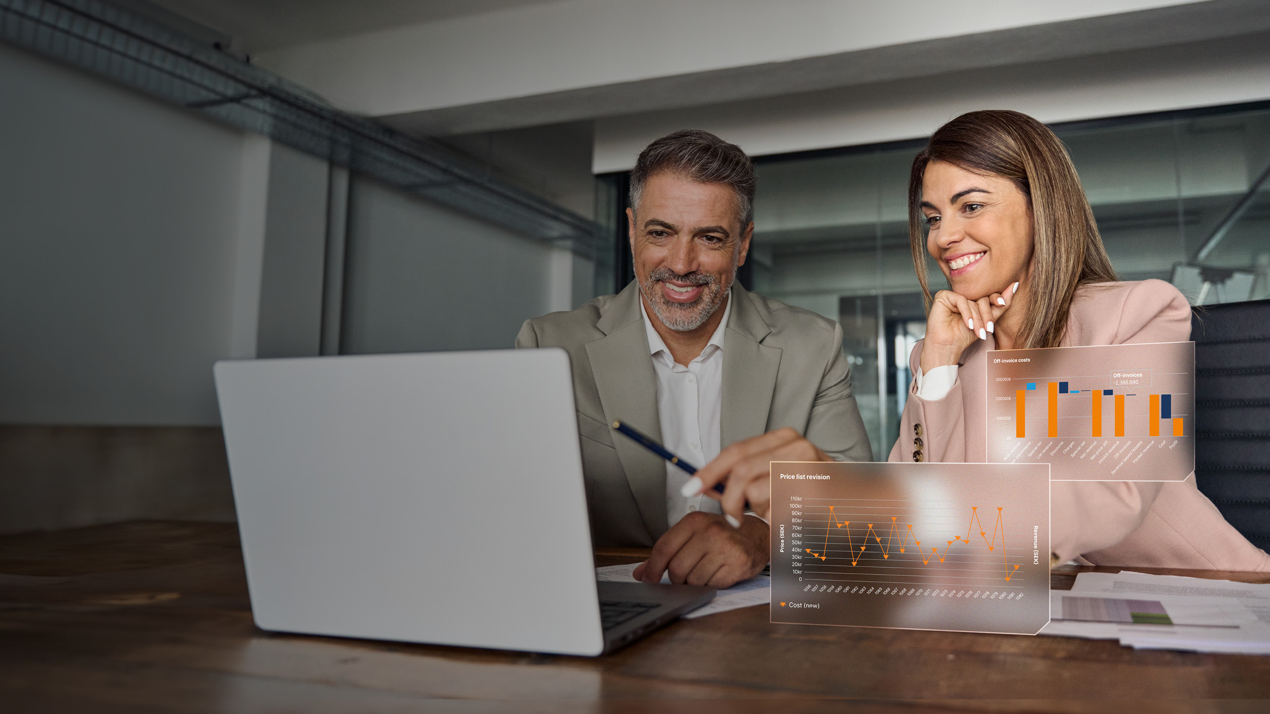 Female business manager consulting male client at office meeting with laptop.